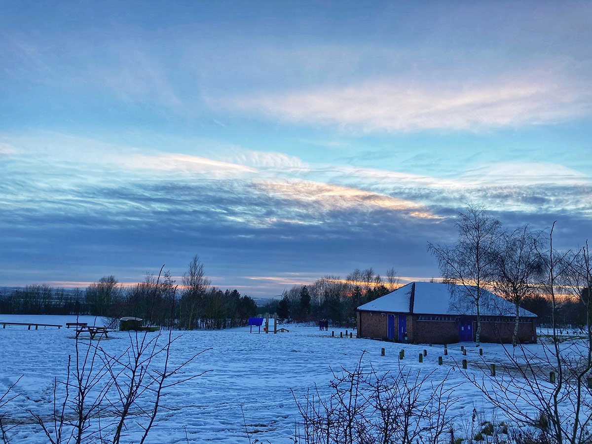 Photograph of A winters sunset over a snowy Dale Road Park