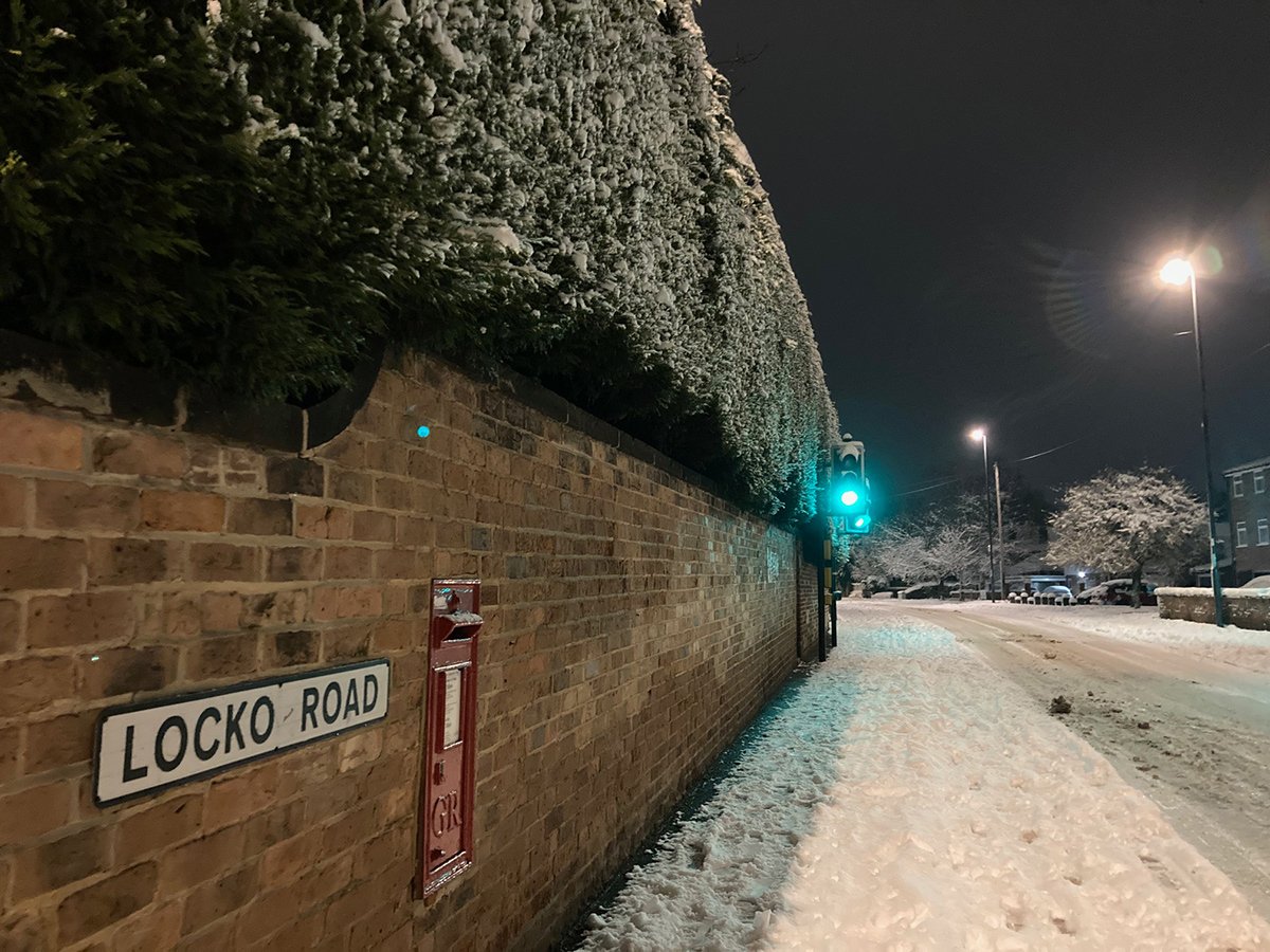 Photograph of A snow-covered Locko Road at night
